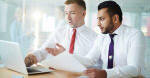 Regulatory specialists reviewing FDA documentation related to GRAS Notice delays