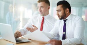 Regulatory specialists reviewing FDA documentation related to GRAS Notice delays