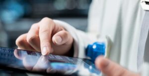 Regulatory professional reviewing MDEL renewal deadline requirements and Annual Licence Review documents before April 1