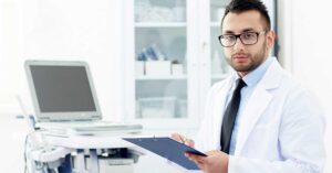 Regulatory professional reviewing Health Canada medical device establishment licence Canada requirements at a desk with compliance documents