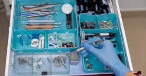 FDA reviewer examining a 510(k) submission package for a dental device