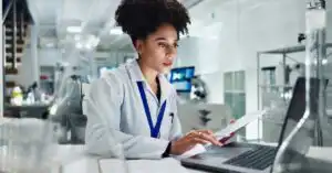 Regulatory professional reviewing MDEL licence cancellation requirements from Health Canada