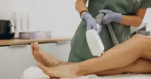 Laser hair removal device undergoing Health Canada compliance review on a clinical table