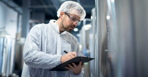 Scientist reviewing FDA dietary exposure assessment data for food ingredient compliance