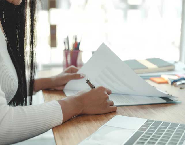 Regulatory professional reviewing documentation in support of an FDA food contact notification